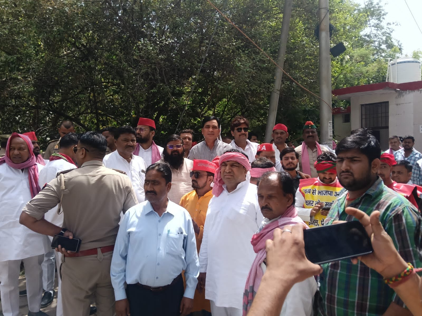 Samajwadi Party workers protesting against rising petrol and diesel prices in Agra during a political demonstration.