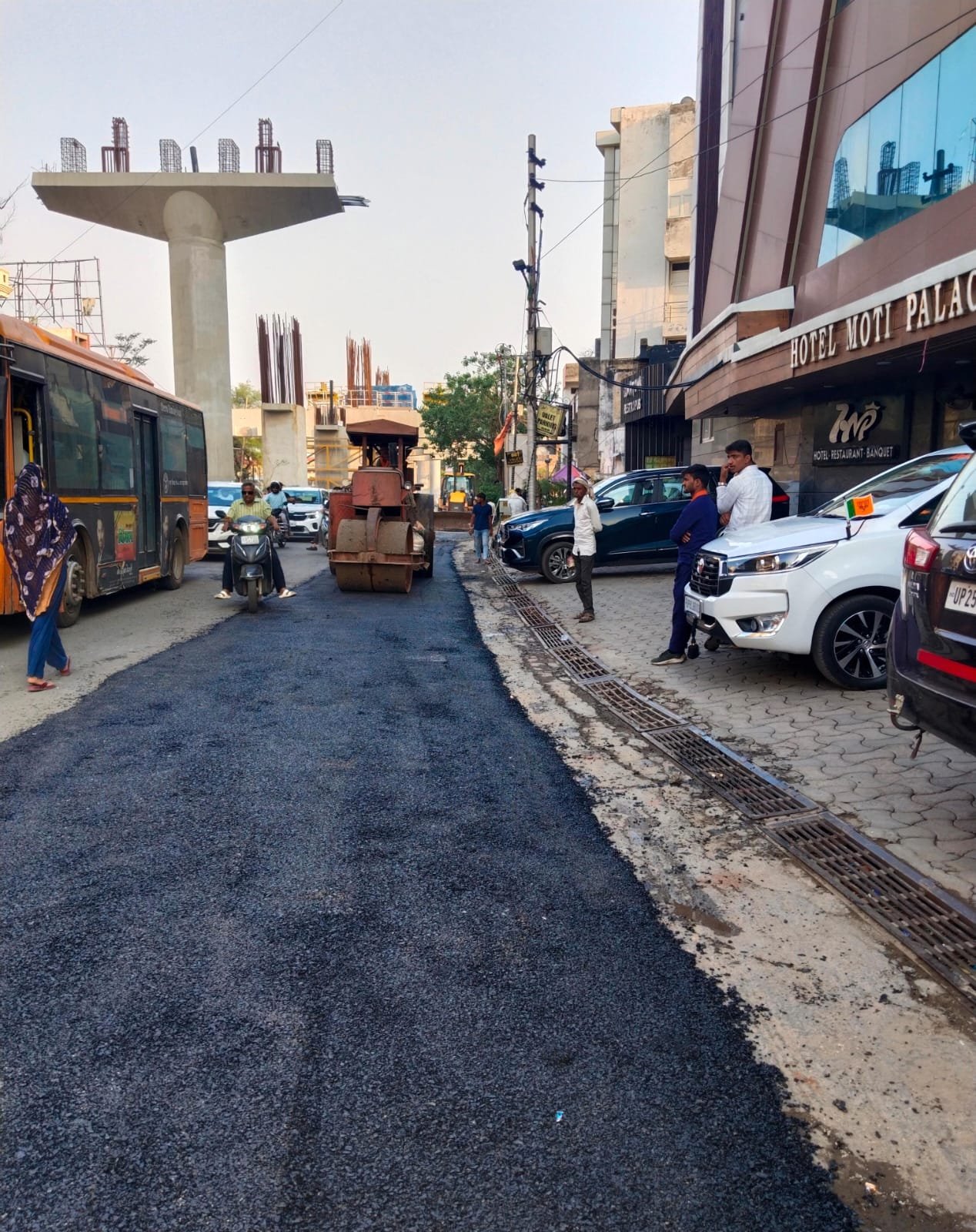Road construction and barricade removal work underway on MG Road under Agra Metro project