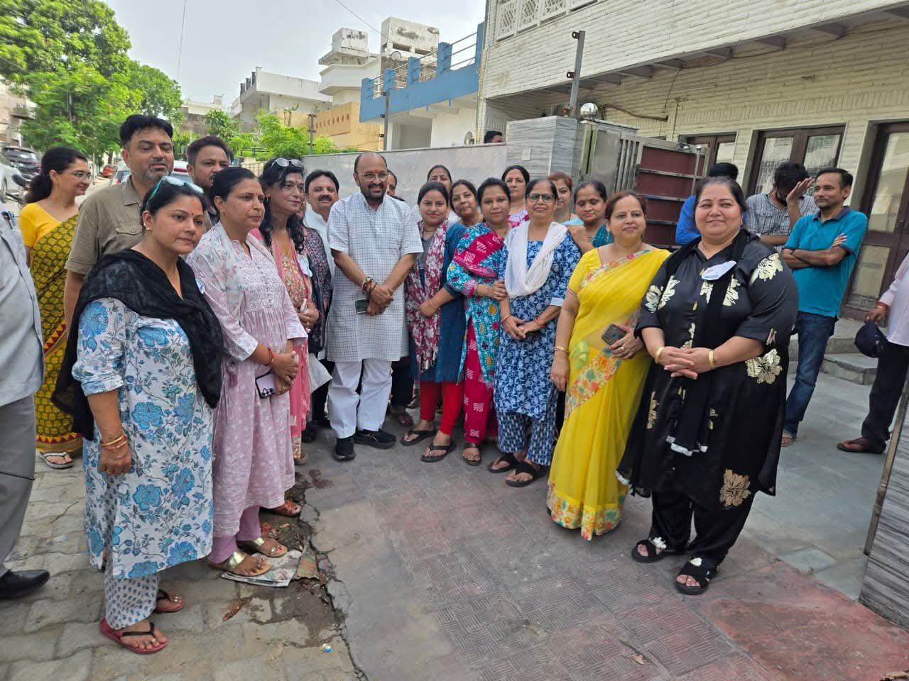 Cabinet Minister Yogendra Upadhyay meets local women protesting against a proposed liquor shop in Jaipur House, Agra.